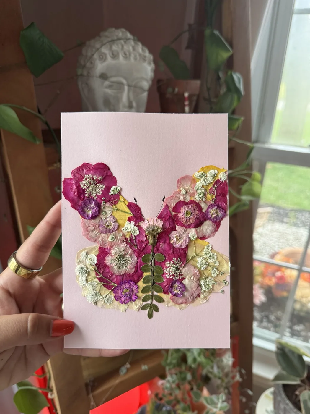A pressed flower butterfly keepsake made from the arrangement
