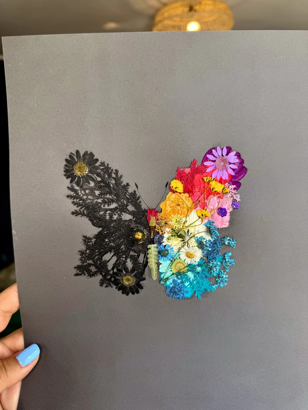 A pressed flower butterfly echoing the tattoo's design
