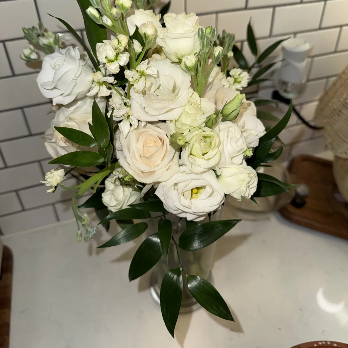 A fresh white rose and greenery bouquet